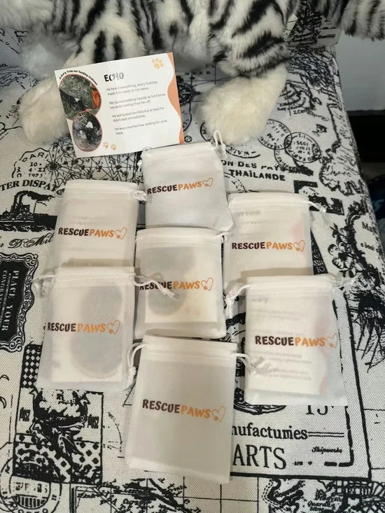 Customer photo: Rescue Paws gift pouches and a card with a dog's photo, name and story